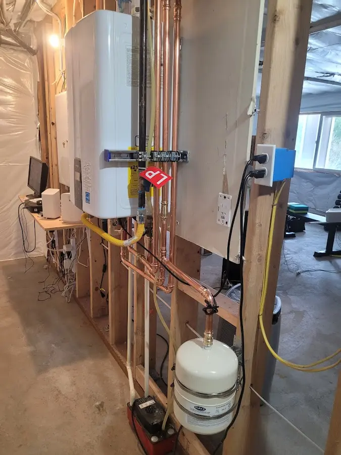 Licensed plumber repairing a kitchen sink in Williamston